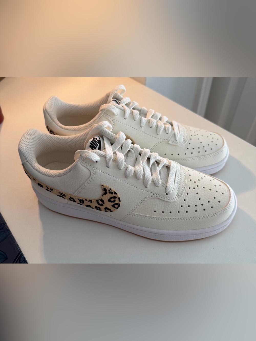 Nike Women’s White Low-Top Sneakers with Leopard Swoosh Accent